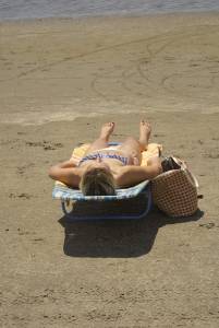 Blonde with tiny bikini sunbathes - Charleston beaches37c3lw6jxo.jpg