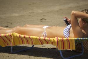 Blonde with tiny bikini sunbathes - Charleston beachest7c3lw13bt.jpg