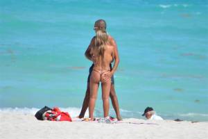 Spying-couple-on-the-beach-from-cafeteria-x20-e7cllq3joz.jpg