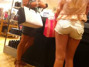 Girls standing at checkout in tiny shorts-37d3u870uk.jpg