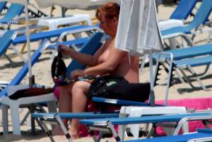 Large redhead woman in bikini in Agia Anna beach, Naxos-v7e4pv5duc.jpg